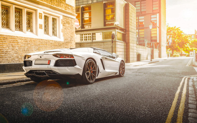White sports car street cityscape free wallpaper for desktop - medium preview image
