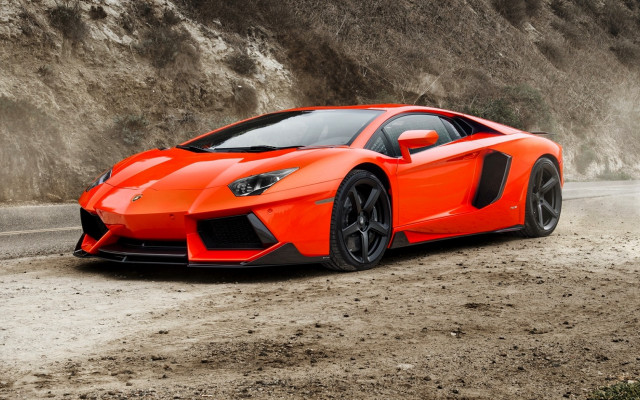 Bright orange sports car cliff free wallpaper for desktop - medium preview image