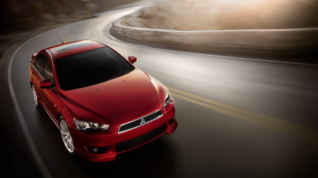 Red car driving road blurry free wallpaper for desktop - medium preview image