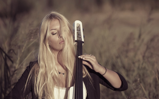 Woman holding cello tall grass free wallpaper for desktop - medium preview image