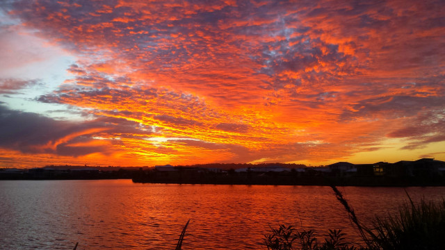 Sunset water clouds building horizon free wallpaper for desktop - medium preview image