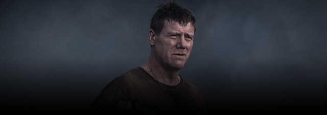 Mohawk man dark room background free wallpaper for desktop - medium preview image