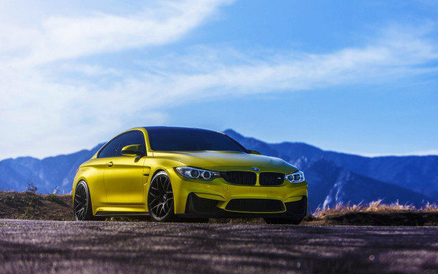 Yellow car mountains road forest free wallpaper for desktop - medium preview image