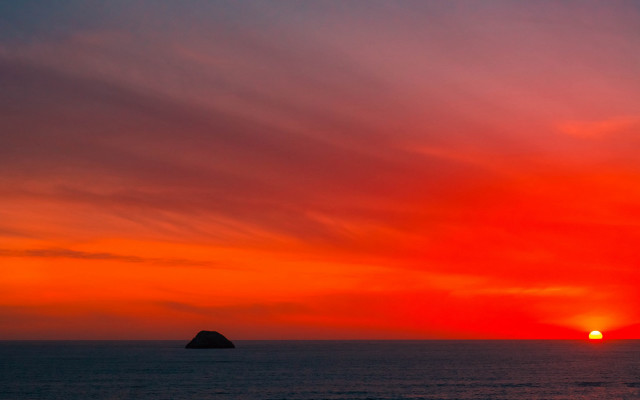 Sunset ocean island clouds mountain free wallpaper for desktop - medium preview image