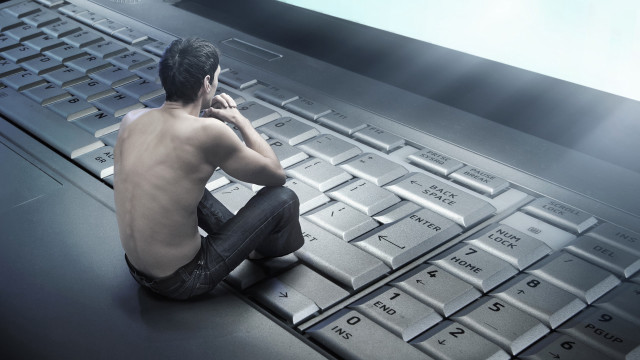 Man sitting keyboard talking phone free wallpaper for desktop - medium preview image