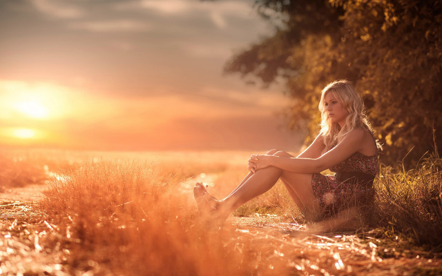 Woman sitting field sunset autumn free wallpaper for desktop - medium preview image