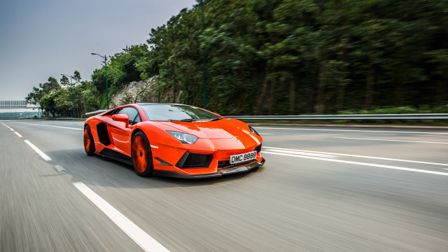 Orange sports car motion blur free wallpaper for desktop - medium preview image