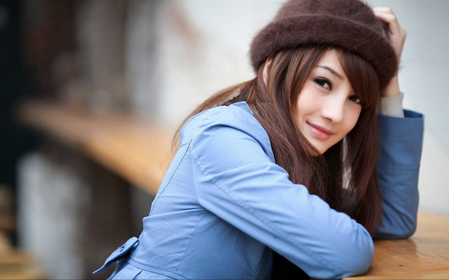 Woman hat leaning bench casual free wallpaper for desktop - medium preview image