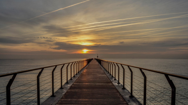 Long pier sunset clouds person free wallpaper for desktop - medium preview image