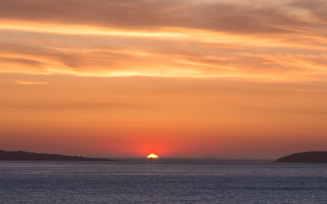 Sunset water boat hill trees free wallpaper for desktop - medium preview image