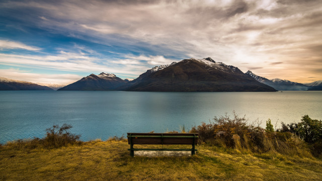 Hillside bench lake mountains cloudy free wallpaper for desktop - medium preview image