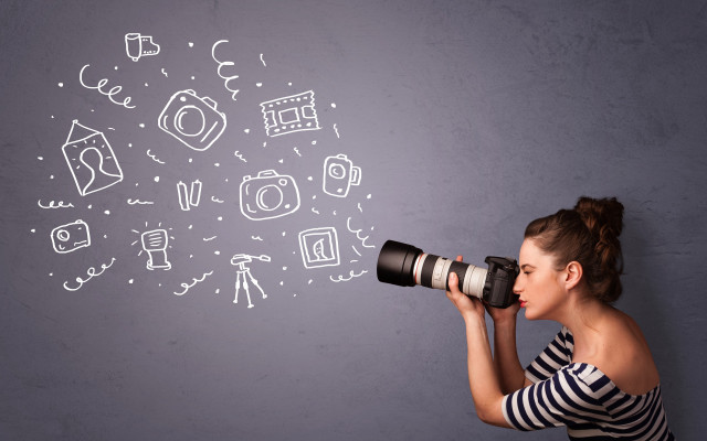 Woman holding camera looking drawing free wallpaper for desktop - medium preview image