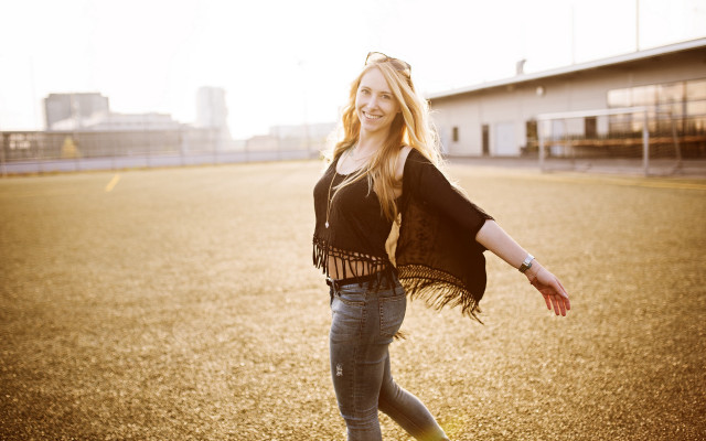 Woman outstretched smiling parkinglot portrait free wallpaper for desktop - medium preview image