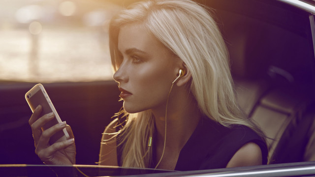 Woman sitting car blonde earbuds free wallpaper for desktop - medium preview image