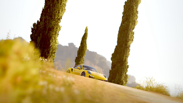 Yellow car hill trees nature free wallpaper for desktop - medium preview image