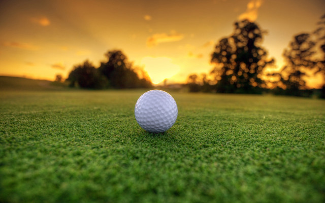 Golf ball green field sunset free wallpaper for desktop - medium preview image