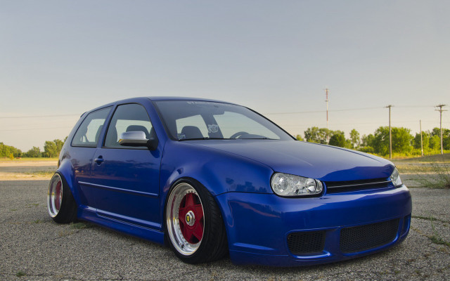 Blue car parking lot grass free wallpaper for desktop - medium preview image