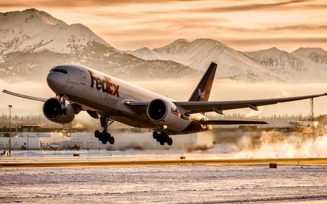 Plane takeoff mountains fog backlit free wallpaper for desktop - medium preview image