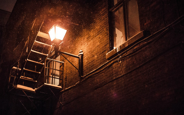 Streetlight brickbuilding stairway window night free wallpaper for desktop - medium preview image