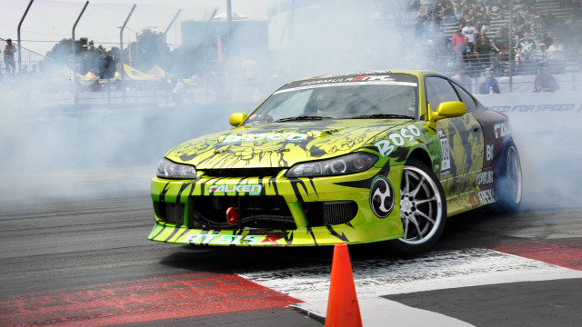 Yellow car smoke track crowd free wallpaper for desktop - medium preview image