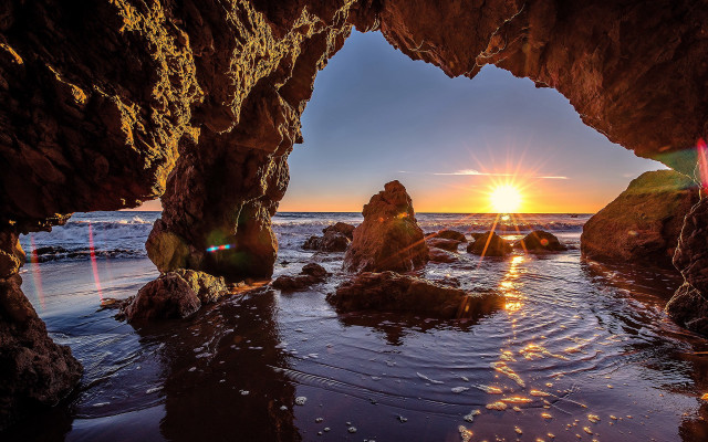 Sunset ocean cave beach rocks free wallpaper for desktop - medium preview image
