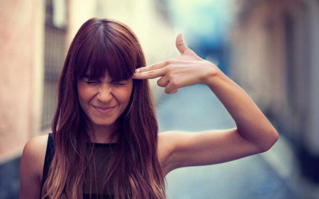 Woman smiling longhair handgesture street free wallpaper for desktop - medium preview image