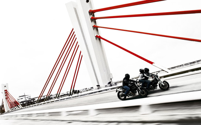 Motorcycles bridge water red poles free wallpaper for desktop - medium preview image
