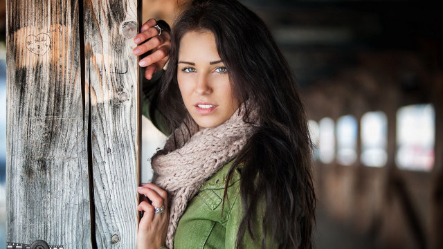 Woman holding door serious look free wallpaper for desktop - medium preview image