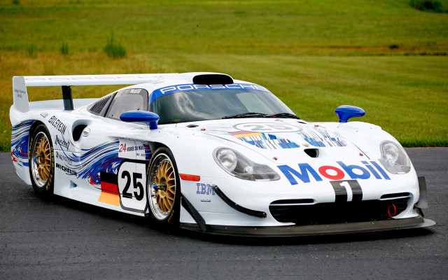 White racecar driving racetrack grass free wallpaper for desktop - medium preview image