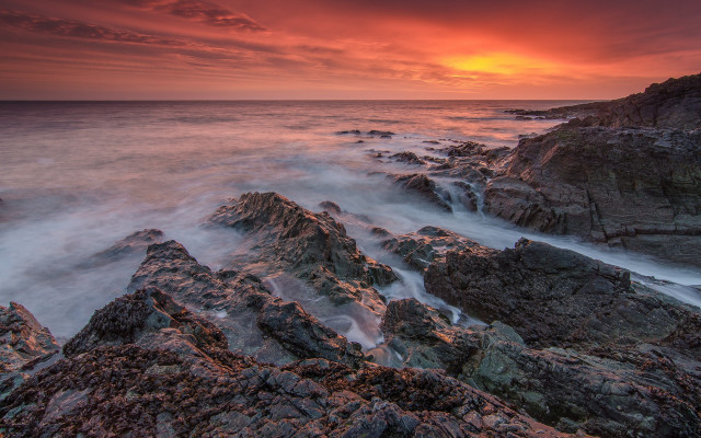 Rocky beach red sunset matte free wallpaper for desktop - medium preview image