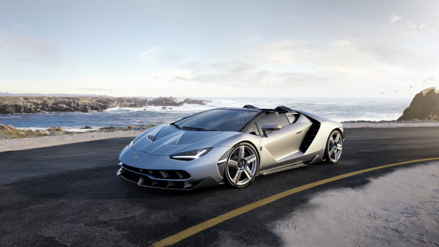 Silver sports car ocean cliff free wallpaper for desktop - medium preview image