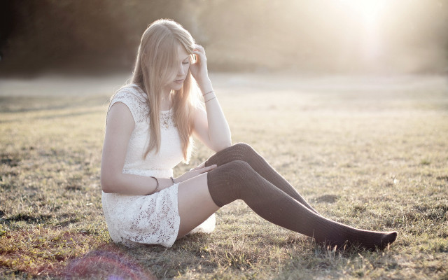 Woman sitting field sunset outdoors free wallpaper for desktop - medium preview image