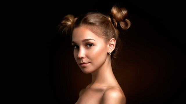 Woman bun ponytail serious portrait free wallpaper for desktop - medium preview image