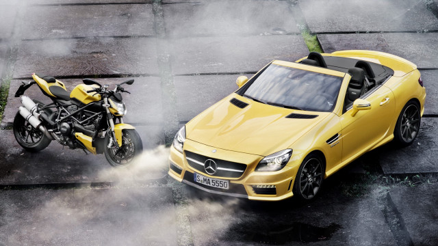 Yellow car motorcycle smoke tiltshift free wallpaper for desktop - medium preview image