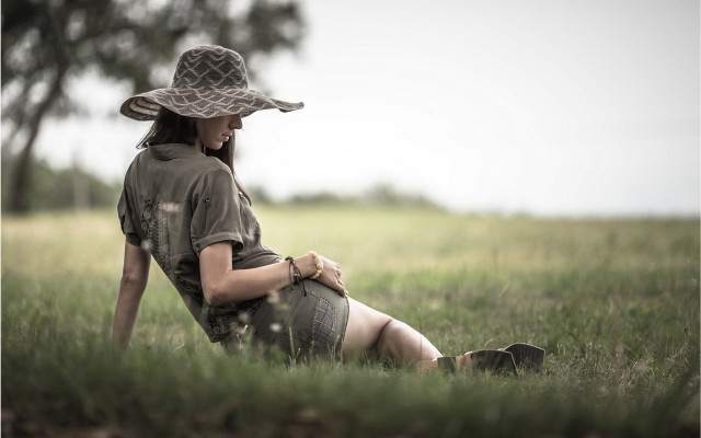 Woman field hat portrait blurry free wallpaper for desktop - medium preview image
