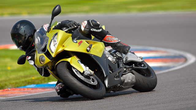 Motorcycle rider race track blurry free wallpaper for desktop - medium preview image