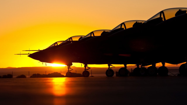 Jet fighter sunset backlit burning free wallpaper for desktop - medium preview image