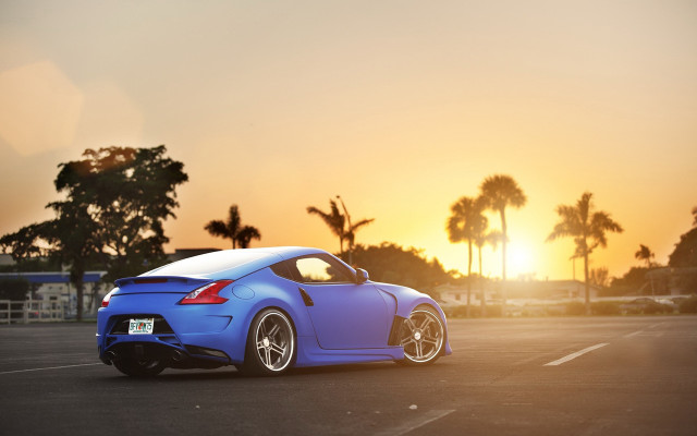 Blue sports car sunset palm free wallpaper for desktop - medium preview image