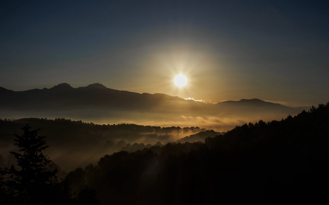 Sunset mountain range trees fog free wallpaper for desktop - medium preview image