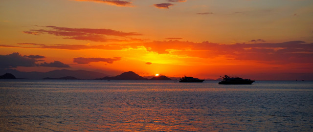 Sunset boats mountain dusk ocean free wallpaper for desktop - medium preview image
