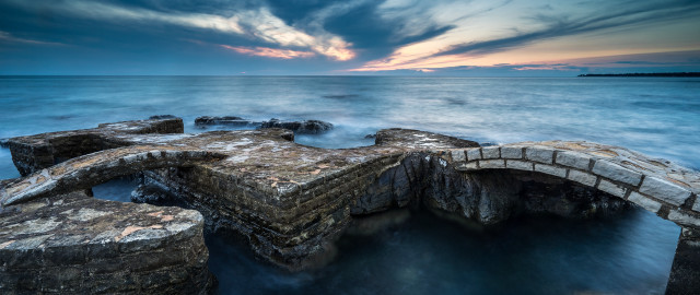 Stone bridge sunset cloudy island free wallpaper for desktop - medium preview image