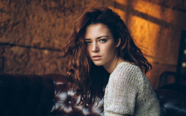 Woman couch wind serious portrait free wallpaper for desktop - medium preview image