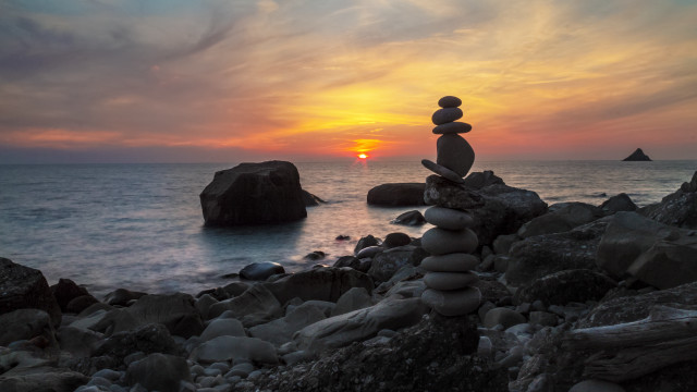 Rock sculpture beach sunset ocean free wallpaper for desktop - medium preview image