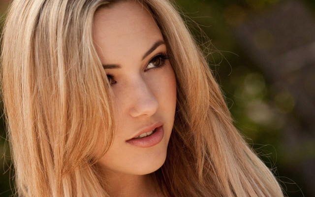 Blonde woman serious face hyperrealism free wallpaper for desktop - medium preview image