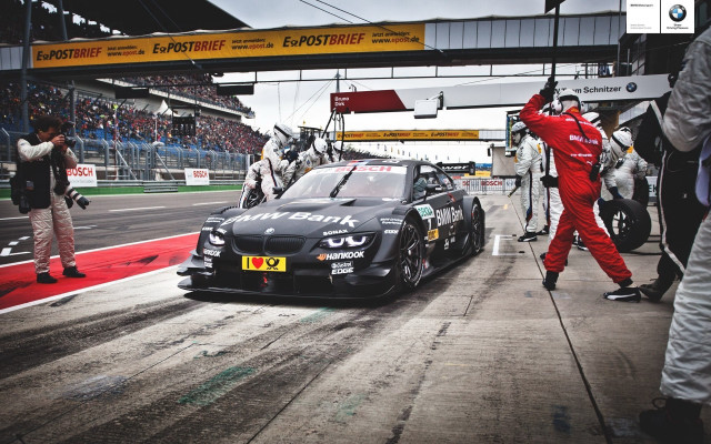 Man red suit race track free wallpaper for desktop - medium preview image