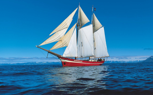 Sailboat ocean mountains blue sky free wallpaper for desktop - medium preview image