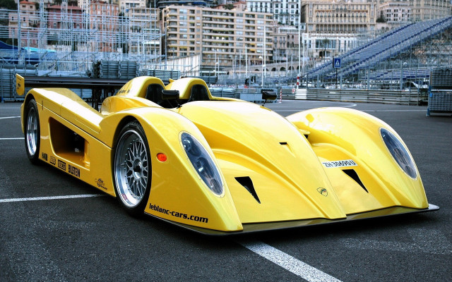 Yellow racecar cityscape night moon free wallpaper for desktop - medium preview image