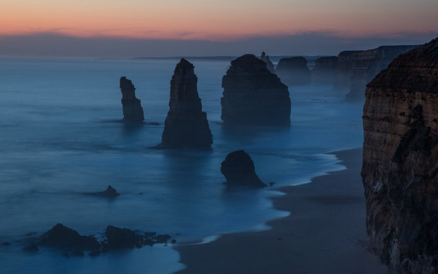 Rocky ocean sunset mountains clouds free wallpaper for desktop - medium preview image