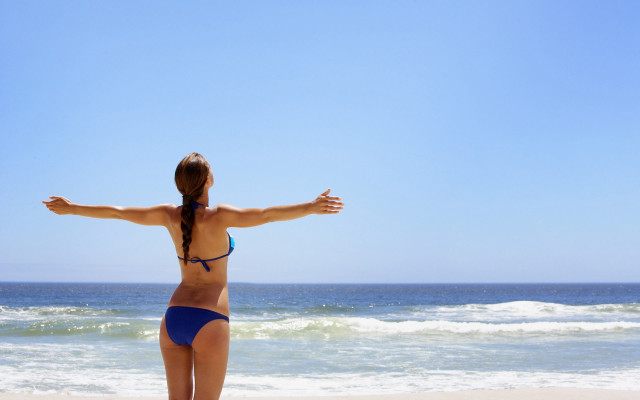 Woman beach bikini outstretched arms free wallpaper for desktop - medium preview image