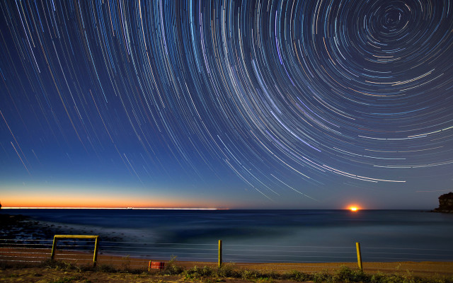 Star trail ocean night lighthouse free wallpaper for desktop - medium preview image